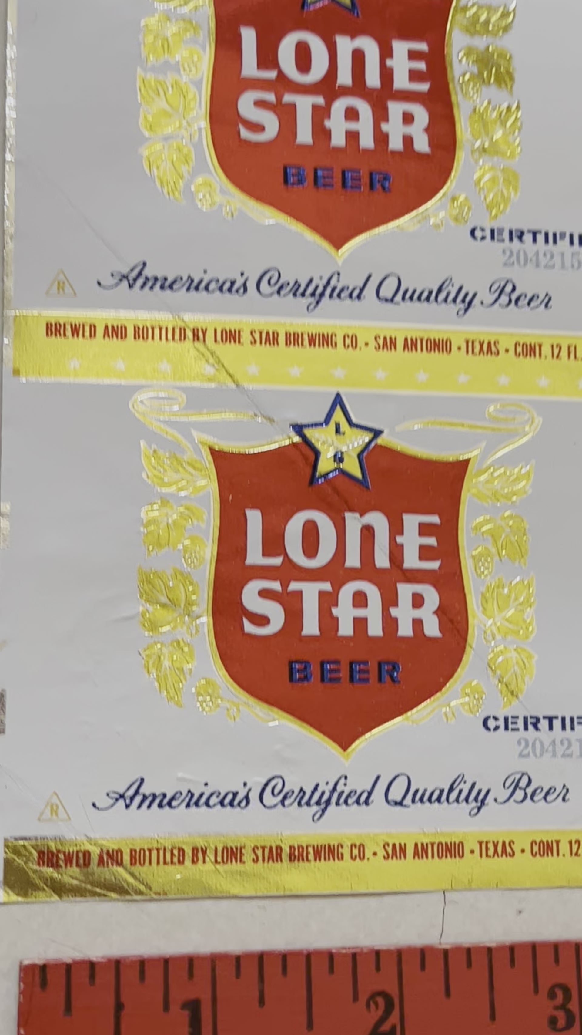 1959 Set of Sheets of Lone Star Embossed Foil Longneck Bottle Labels, with neck label and original bottle.