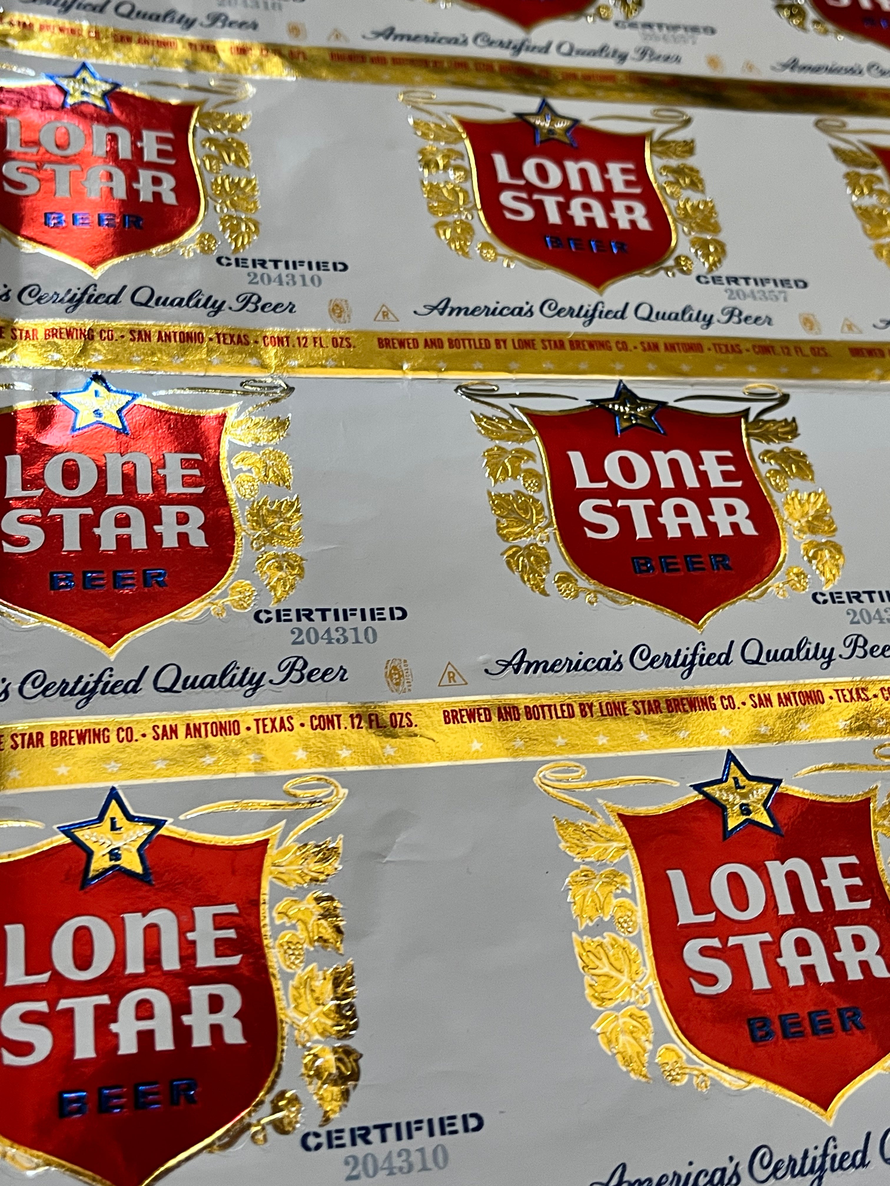 1959 Set of Sheets of Lone Star Embossed Foil Longneck Bottle Labels, with neck label and original bottle.