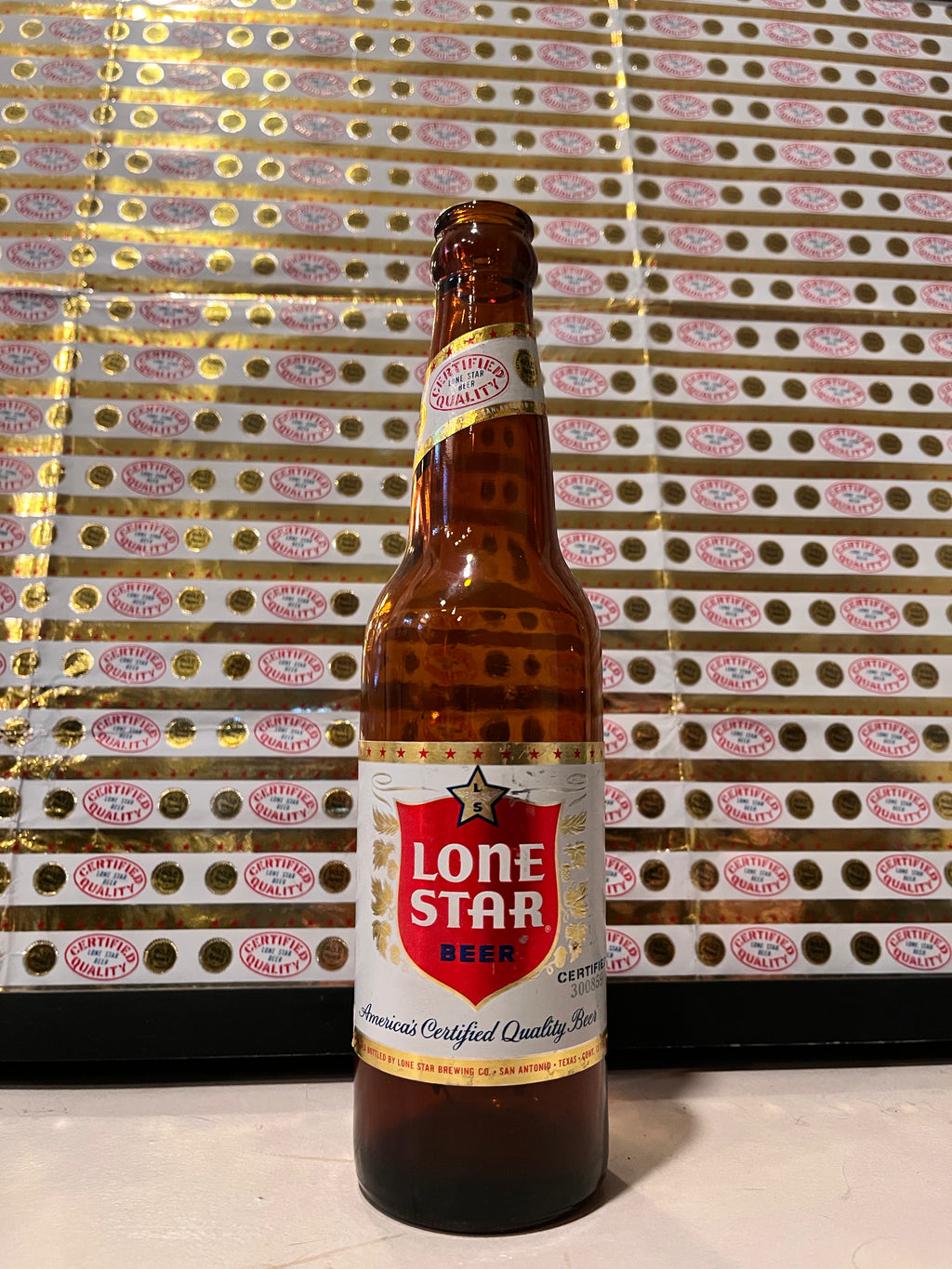 1959 Set of Sheets of Lone Star Embossed Foil Longneck Bottle Labels, with neck label and original bottle.