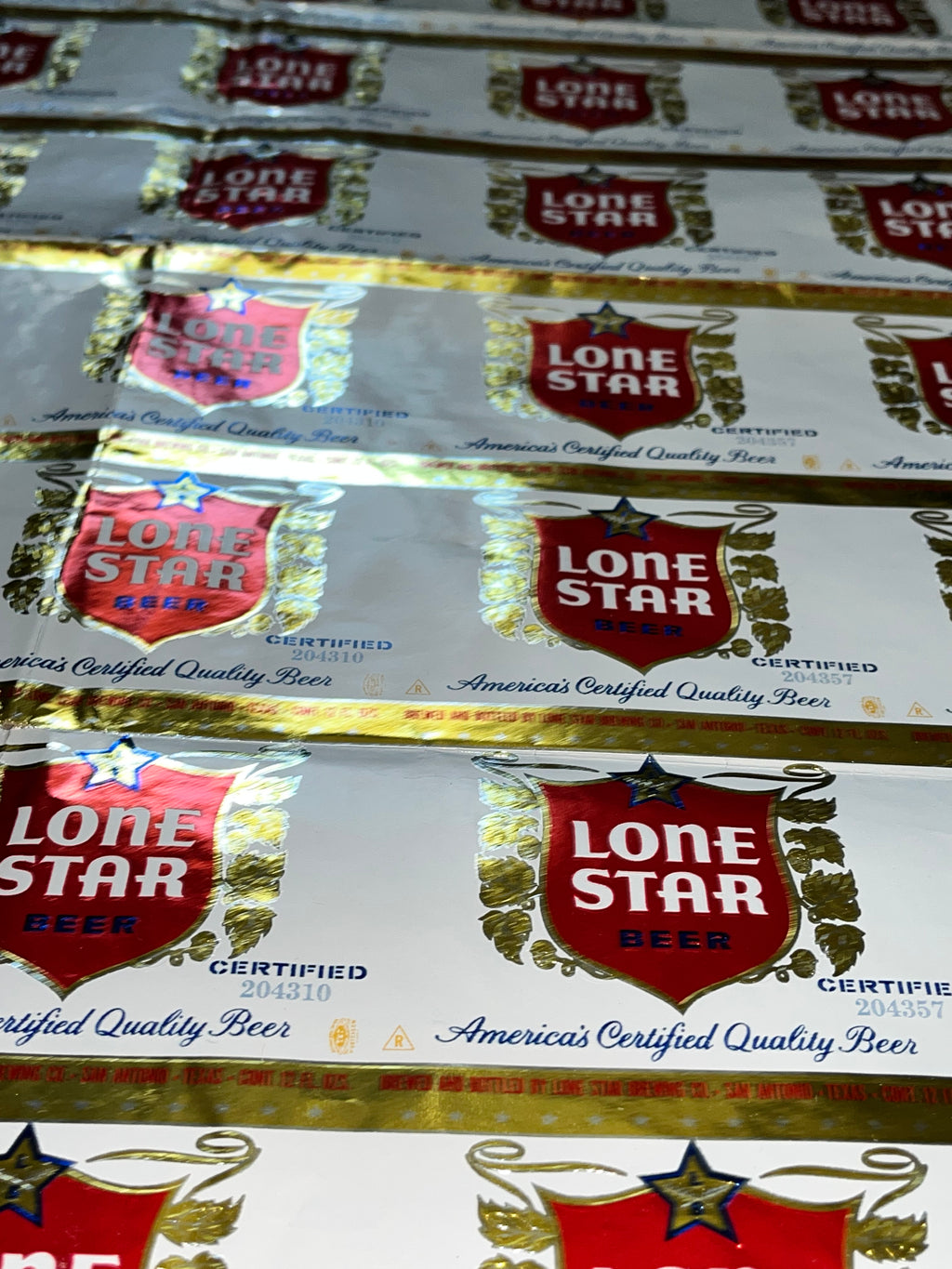 1959 Set of Sheets of Lone Star Embossed Foil Longneck Bottle Labels, with neck label and original bottle.