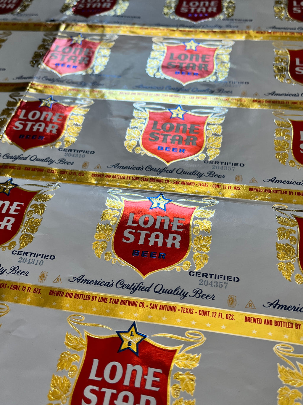 1959 Set of Sheets of Lone Star Embossed Foil Longneck Bottle Labels, with neck label and original bottle.